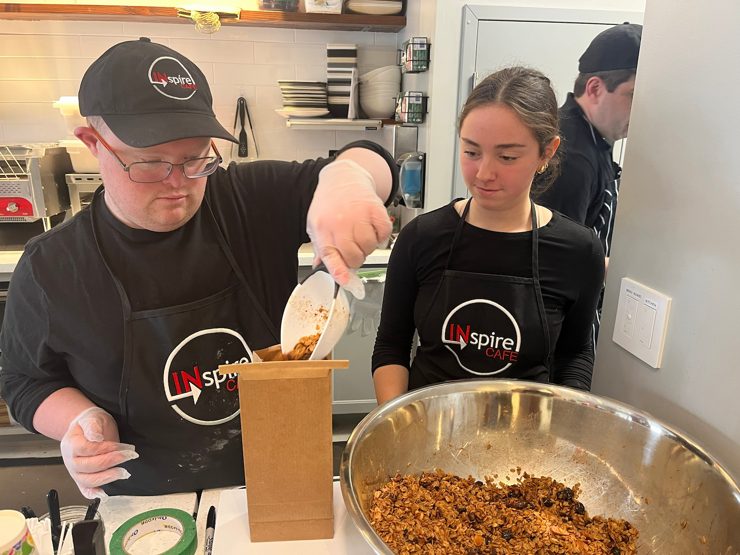 INspire Cafe team members preparing food together