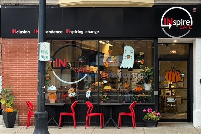 INspire Cafe storefront with seasonal window art